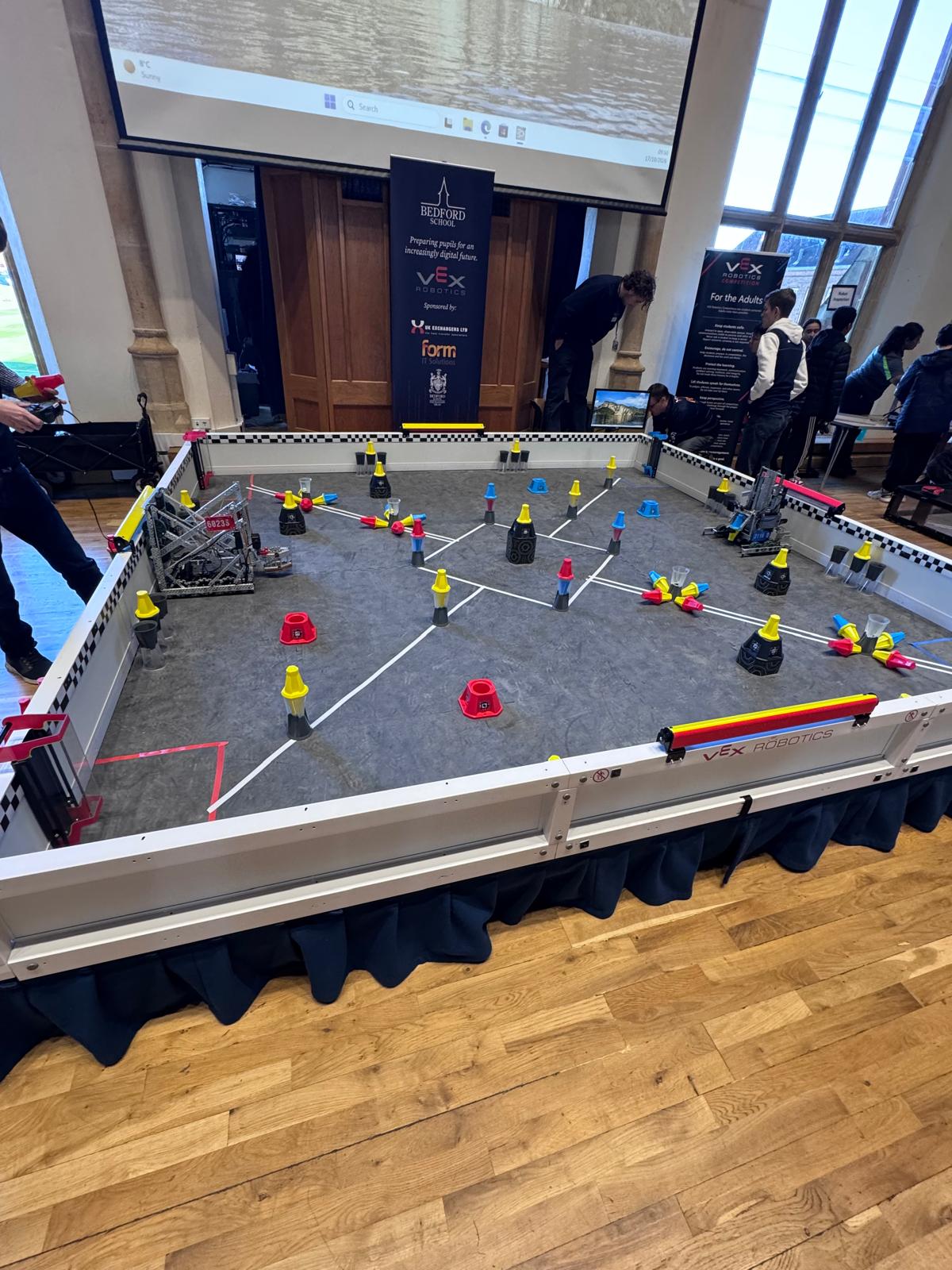 VEX Robotics competition field at Bedford School with robots and game elements